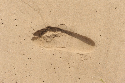 Fußabdruck im Sand in Spanien